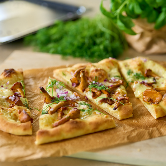 Pinza with chanterelle mushrooms